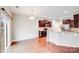 Open kitchen with cherry cabinets, stainless appliances and breakfast bar at 2679 Southern Trace Dr, Waxhaw, NC 28173