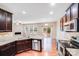 Well-equipped kitchen with stainless steel appliances, granite countertops, and dark cabinets at 2679 Southern Trace Dr, Waxhaw, NC 28173