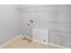 Functional laundry room with tile floors, shelving, and utility connections at 2679 Southern Trace Dr, Waxhaw, NC 28173