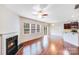 Spacious living room with fireplace, hardwood floors, and plenty of natural light at 2679 Southern Trace Dr, Waxhaw, NC 28173