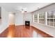 Bright living room with fireplace, hardwood floors, and large windows at 2679 Southern Trace Dr, Waxhaw, NC 28173