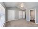 Bright main bedroom with vaulted ceiling, large window, and en suite bathroom at 3010 Golden Dale Ln, Charlotte, NC 28262