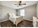 Cozy bedroom with natural light, wood-look floors, and a queen-sized bed, creating a tranquil retreat at 307 Walnut St, Clover, SC 29710