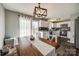 Open-concept dining area with access to a kitchen and a sliding door leading to a deck at 307 Walnut St, Clover, SC 29710