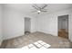 Spacious bedroom featuring ceiling fan, natural light, and closet at 308 Knox St, Clover, SC 29710