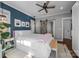 Comfortable main bedroom featuring a ceiling fan and closet with sliding barn door at 329 Fannie Cir, Charlotte, NC 28205