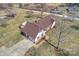 Aerial view of house, pool, outbuildings, driveway, landscaping, and grassy lawn at 332 Goforth Rd, Kings Mountain, NC 28086