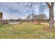 Picturesque backyard features above-ground pool, a red barn, and a generous green space at 332 Goforth Rd, Kings Mountain, NC 28086