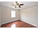 Bright bedroom with hardwood floors, ceiling fan and window letting in plenty of natural light at 332 Goforth Rd, Kings Mountain, NC 28086