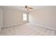 Bright bedroom featuring neutral carpet, a ceiling fan, and natural lighting at 332 Goforth Rd, Kings Mountain, NC 28086