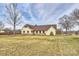 Charming one-story home with stone accents, brown shutters, and a well-manicured lawn at 332 Goforth Rd, Kings Mountain, NC 28086
