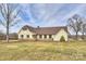 Charming one-story home with stone accents, brown shutters, and a well-manicured lawn at 332 Goforth Rd, Kings Mountain, NC 28086