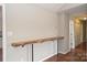 Hallway features a custom wood shelf with industrial supports and access to a hallway and nearby room at 332 Goforth Rd, Kings Mountain, NC 28086