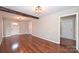 Open-concept living room featuring wood-style flooring, exposed beam, and a bright and airy atmosphere at 332 Goforth Rd, Kings Mountain, NC 28086