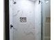Beautiful shower with marble tiling, a rain shower head and built-in niche at 332 Goforth Rd, Kings Mountain, NC 28086