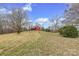 Scenic view of a red barn on a hill, offering versatile storage options at 33320-B Hobe Rd, Albemarle, NC 28001
