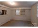 Spacious basement with painted walls and concrete flooring, ready for customization and ample storage solutions at 33320-B Hobe Rd, Albemarle, NC 28001