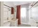 Classic white bathroom with a tub and shower, and a stylish shower curtain at 33320-B Hobe Rd, Albemarle, NC 28001