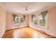 Bright bedroom featuring hardwood floors and ample natural light from three large windows at 33320-B Hobe Rd, Albemarle, NC 28001
