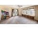 Spacious bedroom with large windows, neutral walls, ceiling fan and built-in shelving at 33320-B Hobe Rd, Albemarle, NC 28001