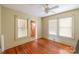 Light-filled bedroom with hardwood floors and glimpses of a kitchen area at 33320-B Hobe Rd, Albemarle, NC 28001