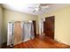Spacious bedroom featuring hardwood floors, and neutral walls with an adjacent doorway at 33320-B Hobe Rd, Albemarle, NC 28001