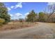 This is a view of a long driveway leading to the house on the property at 33320-B Hobe Rd, Albemarle, NC 28001