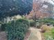Charming home with a beautiful front yard, lush greenery, and a winding walkway at 33320-B Hobe Rd, Albemarle, NC 28001