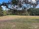 This is a view of the rolling land surrounded by mature trees, offering privacy at 33320-B Hobe Rd, Albemarle, NC 28001