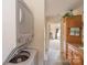 Convenient laundry setup featuring a stacked washer and dryer adjacent to the bathroom at 33320-B Hobe Rd, Albemarle, NC 28001