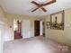 Bright and airy living room with neutral walls and multiple doorways at 33320-B Hobe Rd, Albemarle, NC 28001