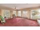 Large open living room with an abundance of natural light from surrounding windows at 33320-B Hobe Rd, Albemarle, NC 28001