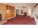 Inviting living room boasts a brick fireplace, built-in shelving, and plenty of natural light at 33320-B Hobe Rd, Albemarle, NC 28001