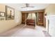 Spacious room featuring built-in shelving, a piano, and a cozy fireplace at 33320-B Hobe Rd, Albemarle, NC 28001