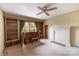 Spacious living room showcasing a piano, fireplace, and built-in shelves at 33320-B Hobe Rd, Albemarle, NC 28001