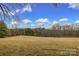 This is a view of the large rolling open land on the property with mature trees at 33320-B Hobe Rd, Albemarle, NC 28001