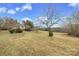 Expansive property view featuring lush greenery and a charming home nestled in the landscape at 33320-B Hobe Rd, Albemarle, NC 28001