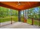 Covered back porch made of brick with wood ceiling and wood railing overlooking beautiful backyard at 3738 Glen Arbor Dr, Maiden, NC 28650