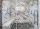 Marble shower with custom tile work, a shower bench and custom rainfall shower head at 3738 Glen Arbor Dr, Maiden, NC 28650