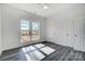 Bright bedroom featuring a large window, sleek flooring, and a double door closet for ample storage space at 3738 Glen Arbor Dr, Maiden, NC 28650