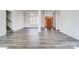 Spacious foyer featuring hardwood floors, a wooden door, and a contemporary chandelier at 3738 Glen Arbor Dr, Maiden, NC 28650
