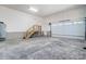 A spacious garage boasts high ceilings, a staircase to an upper level, and an insulated garage door at 3738 Glen Arbor Dr, Maiden, NC 28650