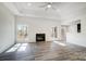 Bright living room showcasing a fireplace, lots of natural light, and an open floor plan for seamless entertaining at 3738 Glen Arbor Dr, Maiden, NC 28650