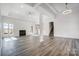Open living space with a fireplace, recessed lighting, and luxury vinyl plank flooring at 3738 Glen Arbor Dr, Maiden, NC 28650