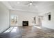 Bright living room with luxury vinyl plank flooring, fireplace, and natural light from large windows at 3738 Glen Arbor Dr, Maiden, NC 28650