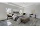 Bright main bedroom suite with a sitting area, tray ceiling, and neutral decor at 3738 Glen Arbor Dr, Maiden, NC 28650