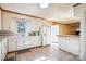 Spacious kitchen with white cabinetry, tiled backsplash, and adjacent dining area at 3901 Starmount Ave, Charlotte, NC 28269