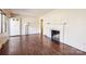 Living room with hardwood floors, a fireplace with tile surround, and natural light at 3901 Starmount Ave, Charlotte, NC 28269