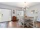 Cozy dining area features a modern chandelier and beautiful hardwood floors, great for Gathering gatherings at 400 Joe Cloninger Rd, Bessemer City, NC 28016