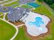 Aerial view of the community pool and clubhouse and beautiful landscaping at 4010 Grace Pointe Dr, Indian Trail, NC 28079